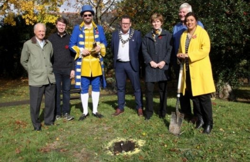 Wealden MP Nus Ghani (right) with: Cllr. Paul Sparks; Cllr. Daniel Manville; Town Crier Ian Bedwell; The Mayor of Uckfield, Cllr. Spike Mayhew; Cllr Claire Dowling; and, Cllr Bob Standley from Wealden District Council. They were planting trees as part of The Queen’s Canopy Scheme.